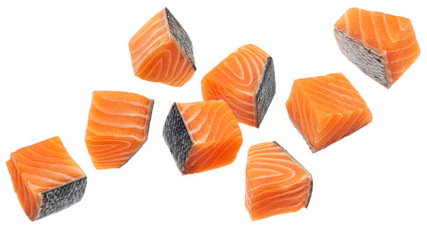 istock Salmon fillet cubes isolated on white background with clipping path 1975283503
