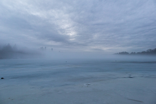 A frozon lake covered in fog - Vancouver, British Columbia