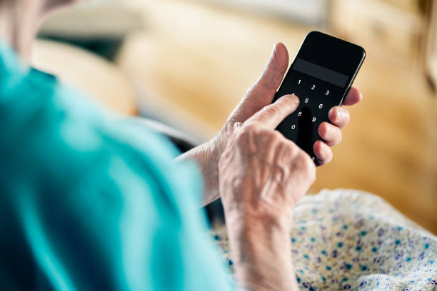istock Old senior woman and phone password number code against online scam. Cyber security. Elder mature person protect bank data with pin lock. Fraud and hoax safety. 1975319289