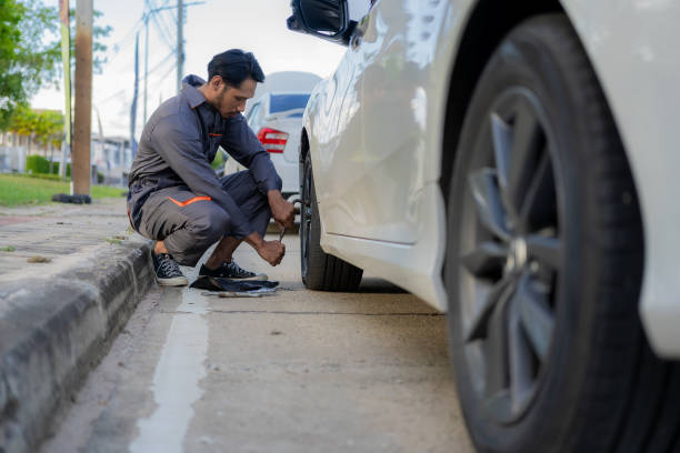istock maintenance concept Asian auto mechanic or smith writing on clipboard at warehouse workshop Technician making checklist for car repair Roadside breakdown and insurance concept 1975324049