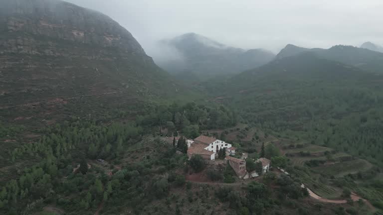 Beautiful farmhouse in middle of misty mountains near Montserrat, Catalonia