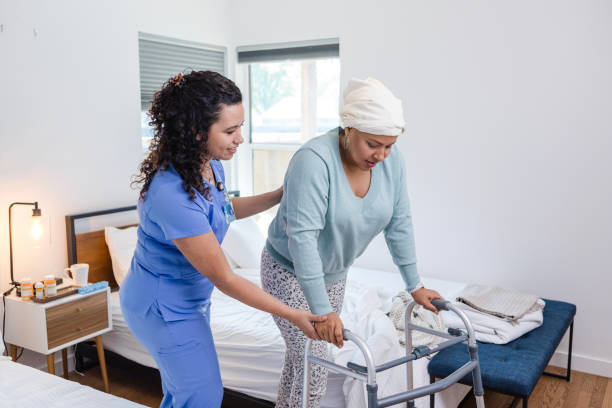istock Female physical therapist helps her patient exercise 1975342715
