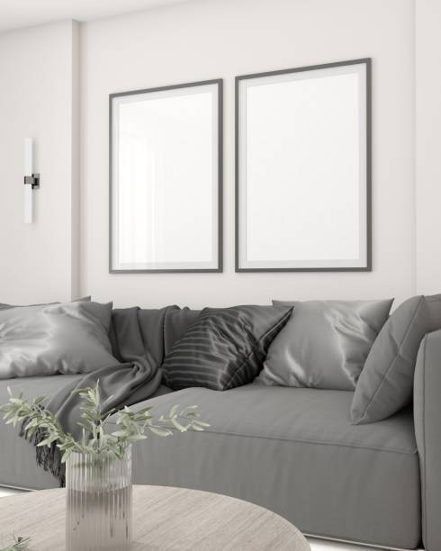 istock Modern minimalist living room with a comfortable grey sofa, twin framed wall art, elegant sconces, and a chic round coffee table. 3D render 1975352170