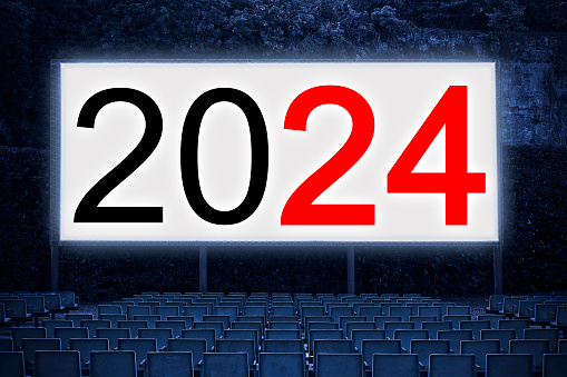 New year 2024 concept with text projected on the screen of an open-air cinema