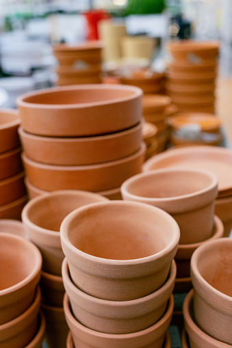 little and big  terra cotta pots isolated on white background