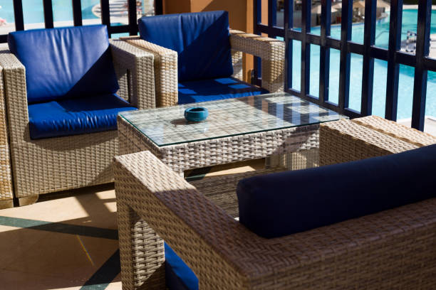 istock Terrace with wicker chairs and a table with an ashtray 1975405776