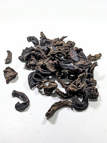 Spiced Goraka on a white background , Dried Goraka