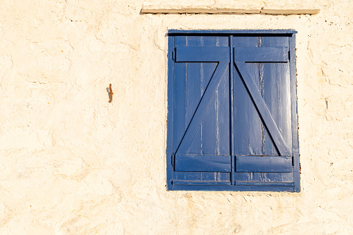 Blue house with curtained door in Chefchaouen, Morocco, Africa.