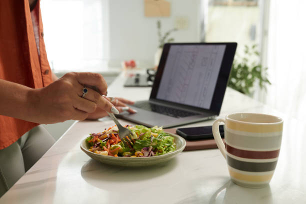 istock IU Designer Eating Salad for Lunch 1975494674