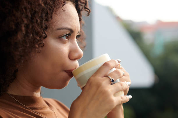 istock Woman Drinking Cup of Morning Coffee 1975497472