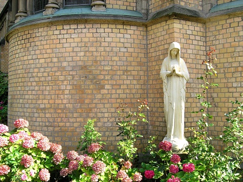 A statue under the church wall in Wuppertal, Germany