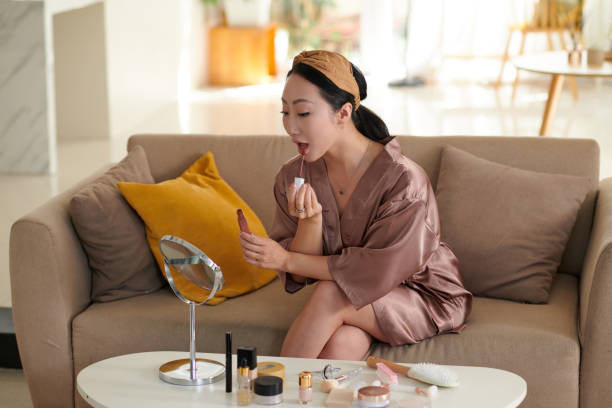 istock Woman Applying Matte Lipstick 1975517221