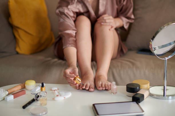 istock Woman Applying Nail Polish 1975518001