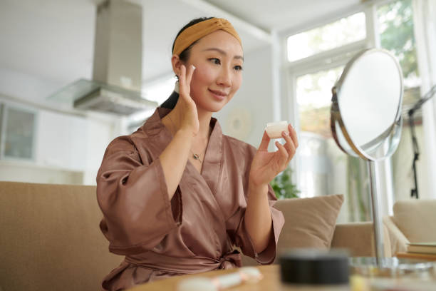 istock Woman Applying Anti-aging Cream 1975519067