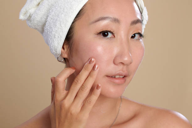 istock Woman Touching Flawless Skin 1975519612