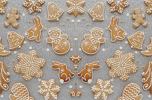 Gingerbread decorated with white royal icing. Table Top View. Design background. Christmas Wallpaper. Symmetry