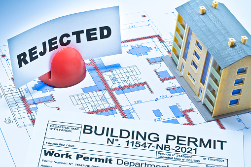 Rejected Buildings Permit concept with declined residential building project and condominium