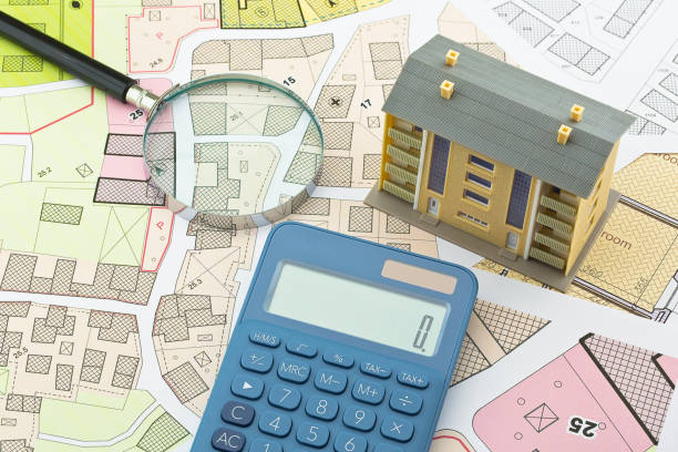 istock Imaginary cadastral map and general urban plan with cadastral parcels, urban destinations, vacant land plots and condominium residential building 1975548840