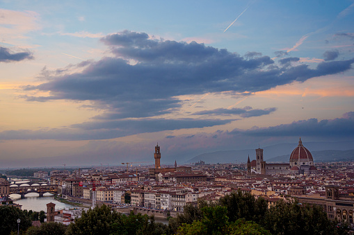 Scenic Skyline View of Arno River day to night transition timelapse, Ponte Vecchio from Piazzale Michelangelo at Sunset, Florence, Italy. Colorful sky. Evening mist