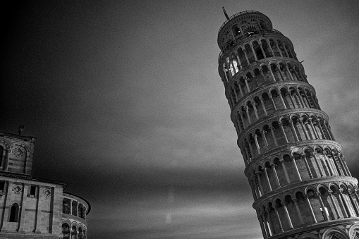 Black and White Pre-Dawn Shot of Leaning Tower of Pisa with Duomo in the Campo dei Miracoli, Pisa, Italy