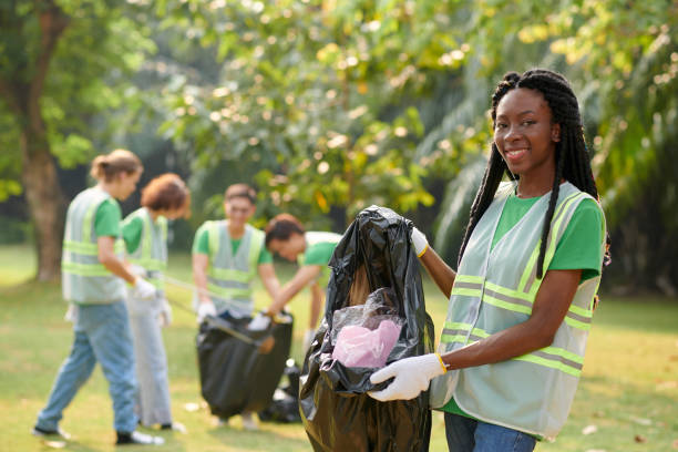 istock Eco Volunteer Showing Bag of Garbage 1975580324