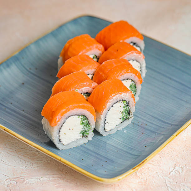 istock Freshly Prepared Sushi on a Wooden Table 1975590686