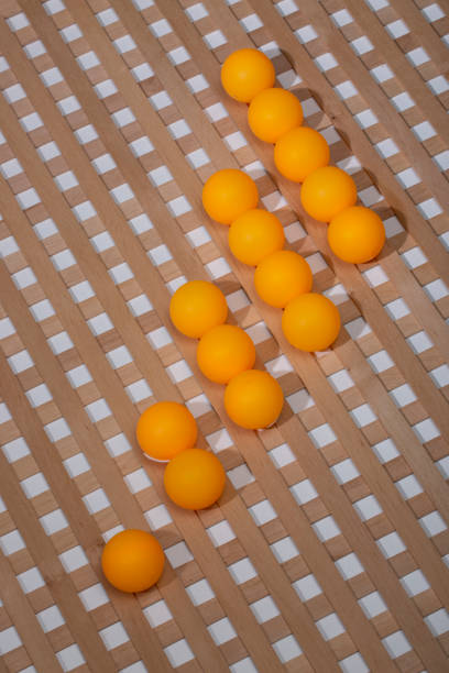 Abstract background with wooden grid and orange balls