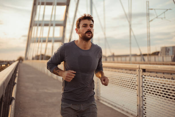 istock Running on the Bridge During Sunset 1975630244