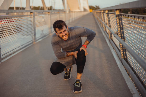istock Athletic Man With Muscle Pain 1975633374
