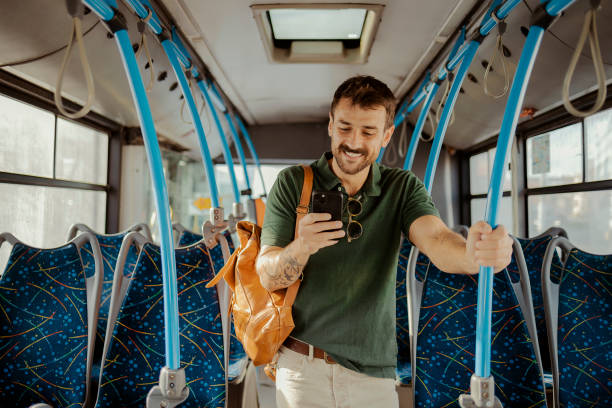 istock Man Texting on Mobile Phone in Public Transportation 1975633885