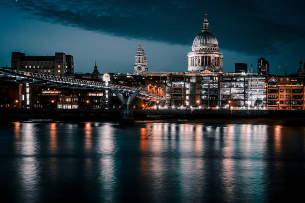 istock St Paul's Cathedral and Millenium Bridge at night in London, UK 1975650633