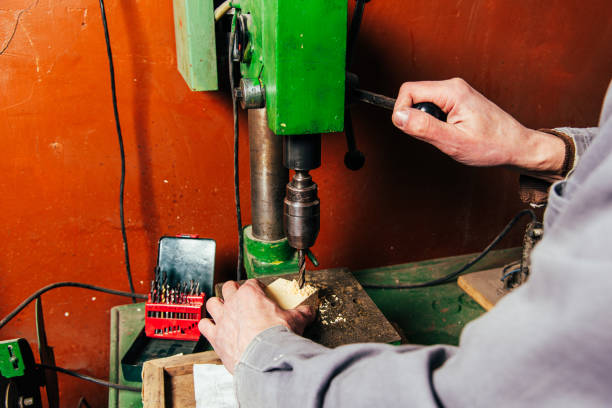 istock A carpenter works in a workshop with a saw, planer and various tools 1975655305