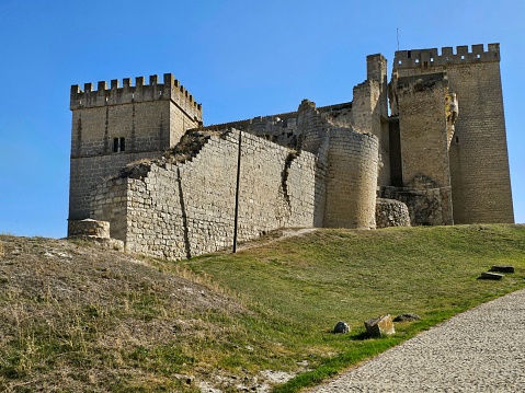 Ampudia - Spain, October 12, 2023: View of the Ampudia castle. Medieval fortress from the 15th century located in the province of Palencia, autonomous community of Castilla y León, Spain. Considered the best castle in Palencia.