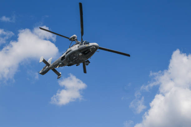 istock Military helicopter flying in the air. 1975680961