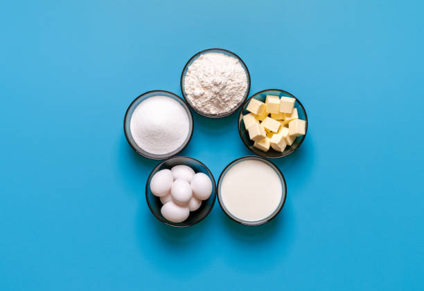 istock Waffle ingredients top view, isolated on a blue background 1975685222