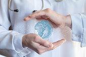 Doctor protects globe with hands gesture.