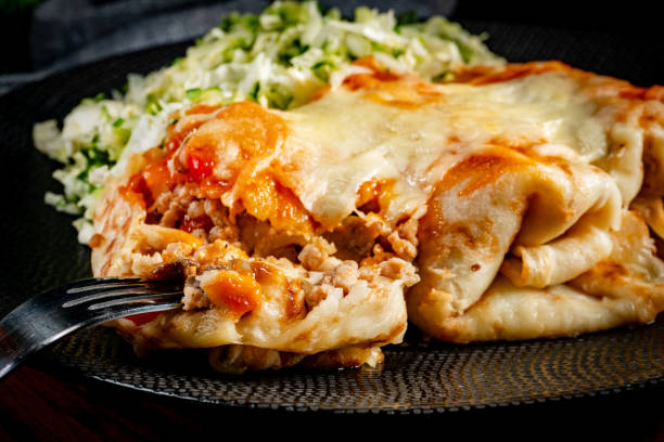 istock Stuffed pancake baked with cheese. 1975691956