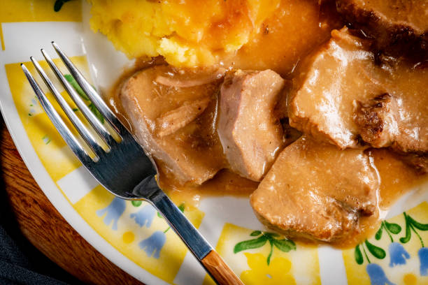 istock Stewed pork tongues in mustard gravy. 1975693993