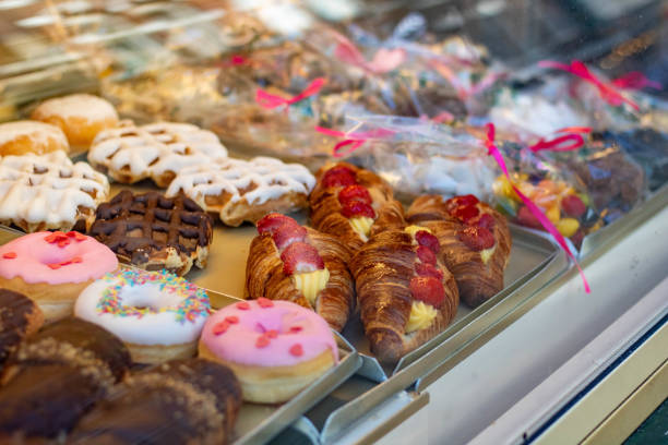 istock Dessert display case full of color - stock image 1975698143