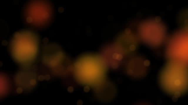 Abstract Gold blurry bokeh background with lights particles on dark background.4k animation footage