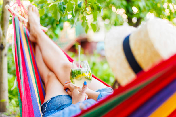 istock Summertime Leisure in a Hammock with Refreshing Mojito 1975775656
