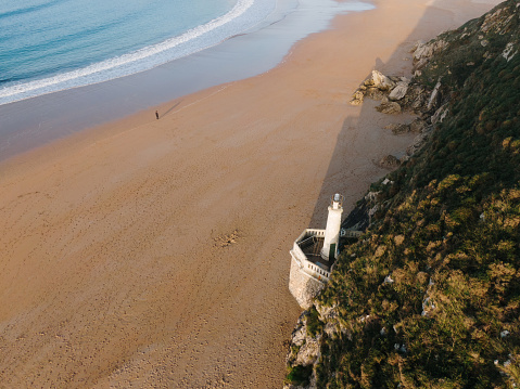 drone aerial zenithal view of a beach at sunrise