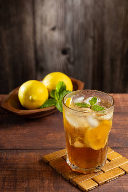 istock Glass of iced tea with lemon and mint. 1975791728