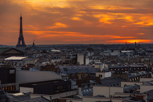 Sunset Serenade: Aerial View of Galeries Lafayette Rooftop, Opera House, and Eiffel Tower