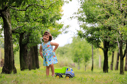 Young girl having fun on a tractor