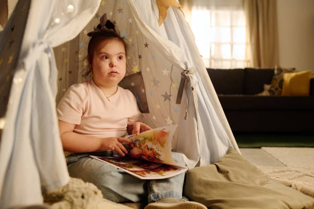 istock Little girl with book of comics 1975852347