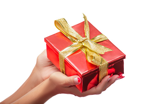 Woman's hands holding a red gift