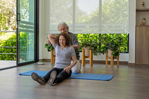 istock An older couple exercising at home to stay active. 1975892786