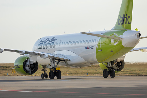 PRAGUE - December 27, 2023: Air Baltic Airbus A220-300 REG:YL-ABL at Vaclav Havel Airport Prague. From Riga to Prague. Air Baltic, legally incorporated as AS Air Baltic Corporation, is the flag carrier of Latvia.