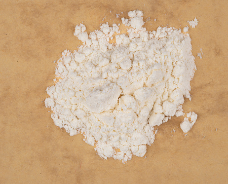 Overhead view of stack of milk powder on a table in the kitchen